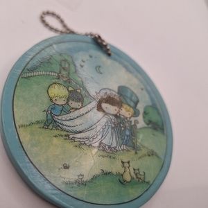 Joan walsh art on key chain - virgo